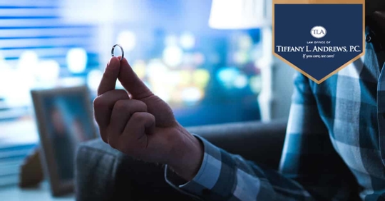 man holding wedding ring up