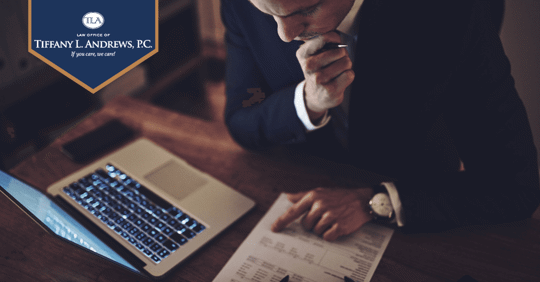 guy looking at paper