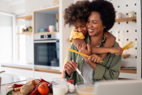 daughter helping mother cook